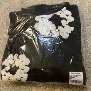 Denim Tears Black Hoodie with White Floral Design